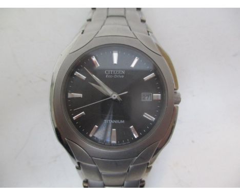 A Citizen Eco-Drive Titanium gents wristwatch having a black dial, baton markers and date aperture at 3, 38mm 