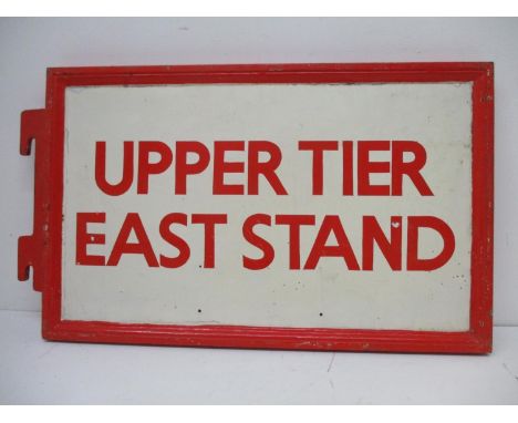 An Arsenal Football Club painted, cast iron and metal sign inscribed 'Upper Tier East Stand', in red and white with a moulded