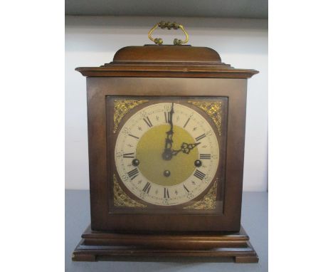 A reproduction walnut bracket clock, the dial having pierced gilt metal spandrels, white chapter ring and a matted brass cent