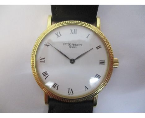 A Patek Philippe Calatrava automatic gents 18ct gold wristwatch circa 1990, ref 3992. The white dial with black Roman numeral