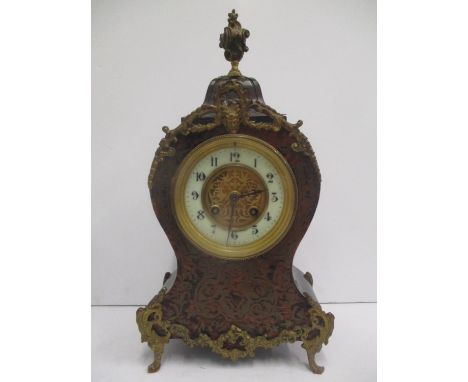A late 19th century French Boulle mantle clock. The dial having a pierced gilt centre and enamel chapter ring with Arabic num