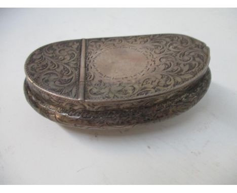 A Victorian silver snuff box by William Aitken Chester 1900, of curved cushion form with a hinged lid, engraved with scrolled