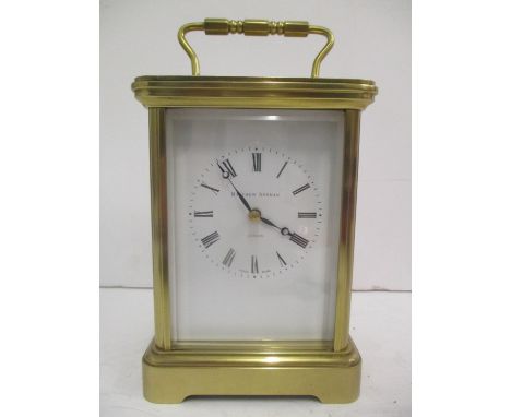 A Matthew Norman brass carriage clock. The eleven jewel 8-day movement striking on a gong and numbered 1750A, 7"h including h