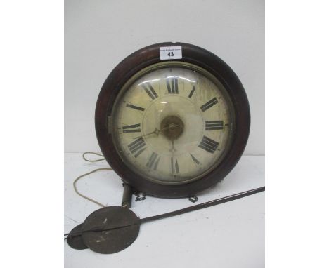 A Victorian postman's alarm clock having a circular mahogany case, painted dial and striking on a bell, 12" x 12" 