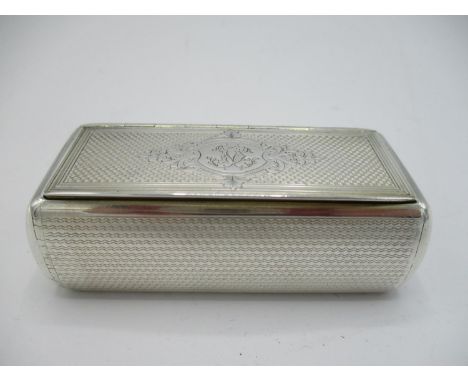 A 19th century white metal snuff box of rectangular form, 2 3/4"l, 1 5/8"w, 1"d, with engine turned decoration and engraved l