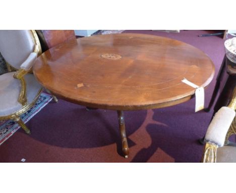 A late 19th Century Victorian mahogany and inlaid oval topped breakfast table, raised on carved tripod supports, with faults 