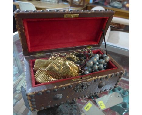 A collection of costume jewellery, to include necklaces, earrings, coin purses, a bangle etc, in a stud bound jewellery box 