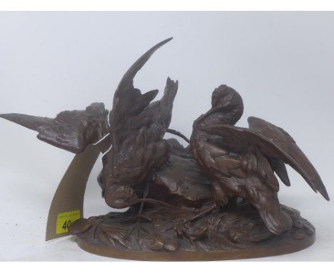 A cast bronze sculpture of two birds on a naturalistic base, signed, H.23cm 