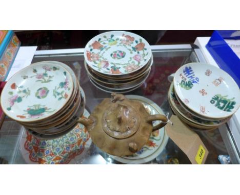 A set of twenty four Chinese painted plates with marks to the base, together with a Chinese teapot with carved decoration (qt
