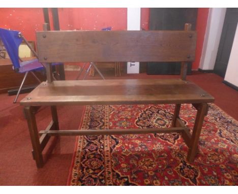 A French oak bench, by L'Atelier Morales, of simple pegged construction, H.85cm W.108cm D.40cm 