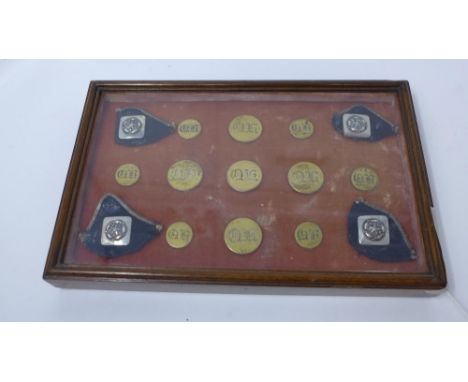 A set of cased quorn hunting buttons, bearing label to verso, 'A set of quorn hunting buttons and four silver buttons showing