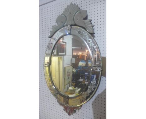 An early 20th century Venetian mirror, with bevelled glass plate, acid etched floral decoration, floral finial, H.85 W.46cm 