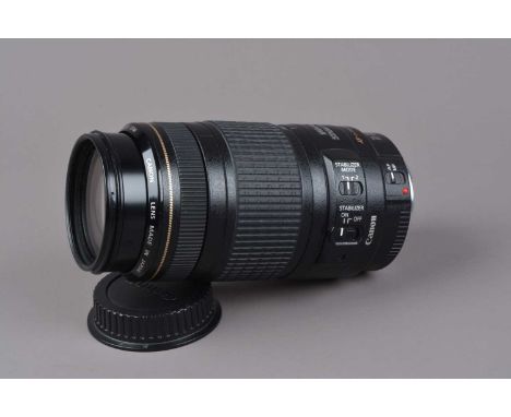 A Canon EF 70-300mm f/4-5.6 IS USM Lens, auto focus functions, barrel G-VG, elements G-VG, with front/rear caps and manual