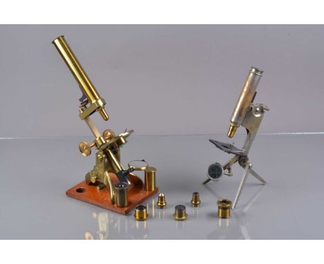 Microscopes circa 1900,  lacquered brass Compound Monocular Microscope, with two eyepieces, rack and pinion focusing, two obj
