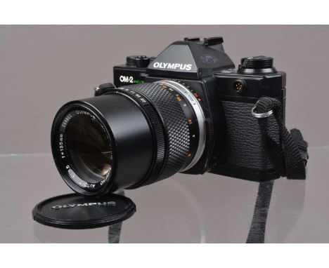 An Olympus OM-2 Spot/Program SLR Camera,  shutter working meter responsive, self timer inconsistant, otherwise appears to fun