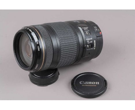 A Canon EF 70-300mm f/4-5.6 IS USM Lens, auto focus functions, barrel G-VG, some fading to grip, elements VG, with front/rear