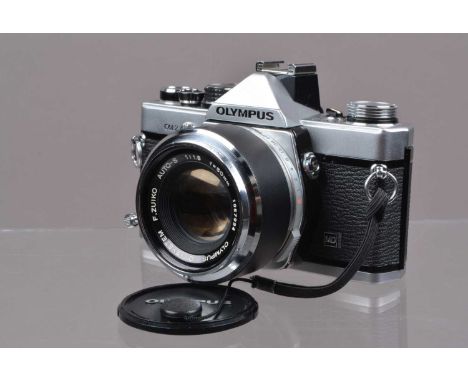 An Olympus OM-2 MD SLR Camera, shutter working, meter responsive, self timer working, responsive in auto mode, body G-VG, lig