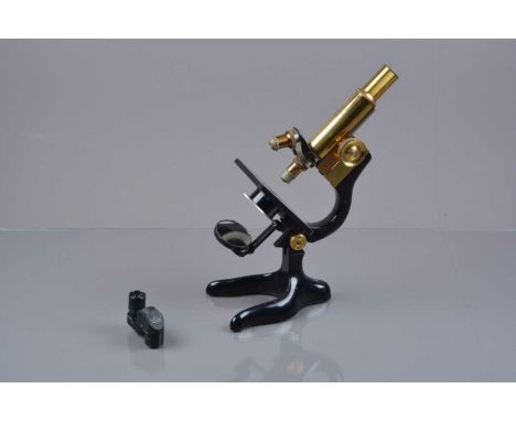 A mid-20th Century lacquered brass and black-enamelled Leitz Student Microscope,  with double nosepiece, Ogilvy objectives (2
