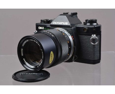An Olympus OM-2 Spot/Program SLR Camera,  shutter working, meter responsive, self timer working, appears to function as shoul