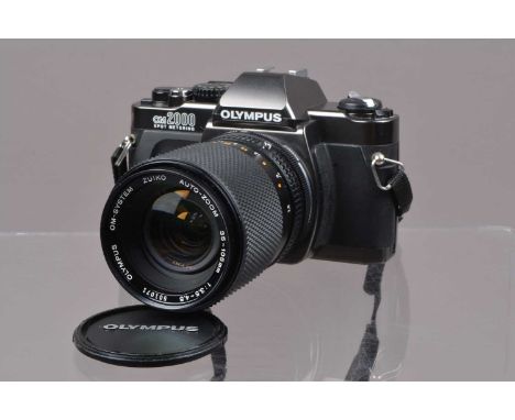 An Olympus OM 2000 SLR Camera,  shutter working, meter responsive, self timer working, body G, with Zuiko 35-105mm f/3.5-4.5 