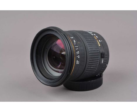 A Sigma EX Macro 18-50mm f/2.8 DC Lens, Sigma AF mount, auto focus untested, barrel G, light fading to grip, elements F-G, so