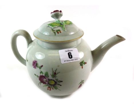 A Worcester porcelain teapot and cover, circa 1770, the globular body enamelled with polychrome sprays and scattered flowers,