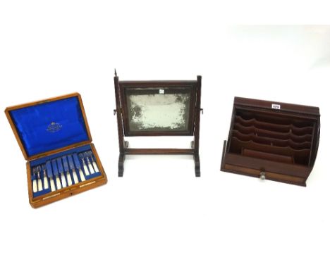 A mahogany desk top stationery cabinet, 20th century, with tambour shutter, 34.5cm wide, a mahogany swing toilet mirror, 19th