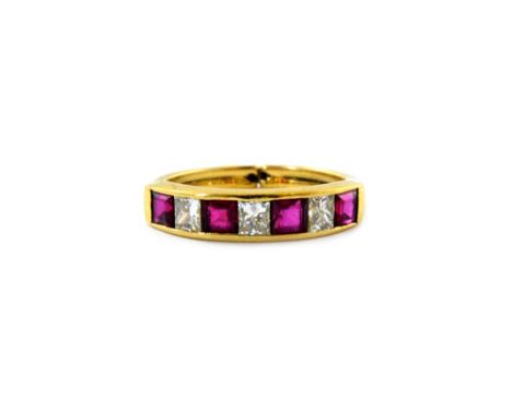 A modern ruby and diamond seven stone half-eternity ring, the four square step-cut rubies spaced by princess-cut diamonds app