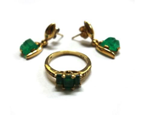 A gold, emerald and diamond ring, centred by three step-cut diamonds, detailed '14K', 3.7g gross and a pair of gold and emera