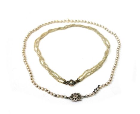 A cultured pearl single row necklace, the cultured pearls graduated approx. 7.2mm to 3.4mm, knotted on a diamond chip clasp, 