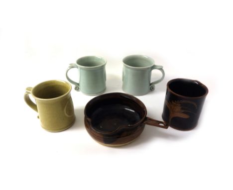 A Leach pottery St Ives pouring dish, rounded bowl and lip and narrow side handle brown black glaze, 13.5cm diameter, impress
