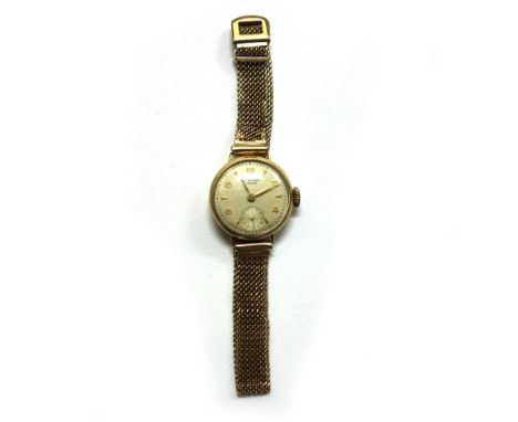 J W Benson, a lady's 9ct gold cased bracelet watch, circa 1947, silvered dial with Arabic and arrow head numerals and subsidi