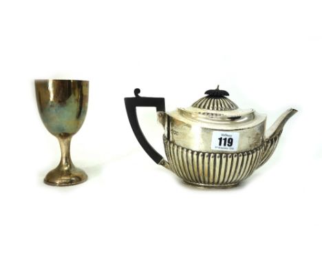 A Bachelor George III style oval silver teapot, Messrs Barnards, London 1899, part lobed and fluted and a George V silver tro