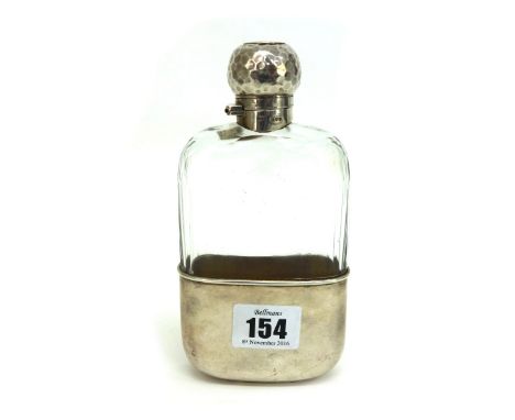 A Victorian silver mounted glass spirits flask, with spot hammered screw cap, makers mark W.G., London 1891, the pull-off cup