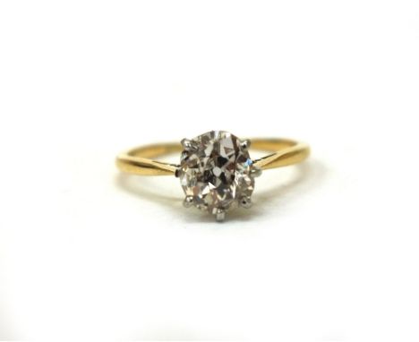 A diamond solitaire ring, the old-cut stone approx. 1.13cts, claw set in white to a yellow shank, stamped '18ct Plat', finger