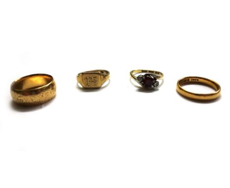 A collection of four rings, comprising; a 22ct gold wedding band, Birmingham 1961, 3.8 grams; an 18ct gold broad band engrave