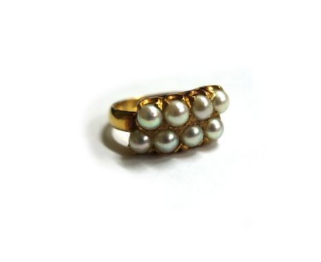 A Chinese yellow precious metal and cultured-pearl ring, the eight beads claw set in an off-set pattern, on a plain D section