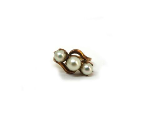 A gold and cultured pearl ring, the three beads in a cross over claw setting, detailed 18K and ALEX, size P1/2, 5g gross. 