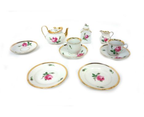 A Meissen porcelain part tea service, 20th century, painted with roses and gilded, teapot, tea caddy, milk jug, two cups, thr