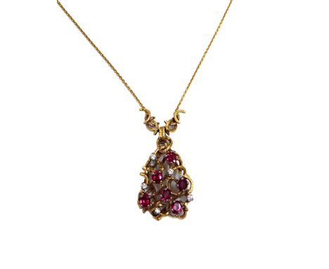 An 18ct gold, ruby and diamond necklace, the front claw set with six oval mixed cut rubies and five small round brilliant dia