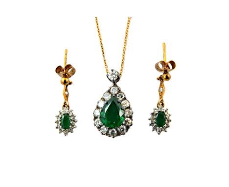 An emerald and diamond cluster pendant and a pair of earrings, the drop-shaped pendant centred with a pear-shaped emerald app