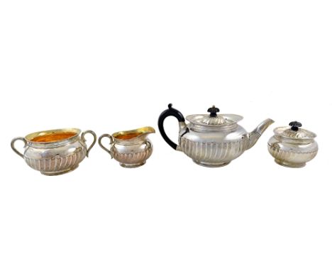 A late Victorian four piece silver tea service, Thomas New Bond Street, London 1898, compressed circular form, embossed with 
