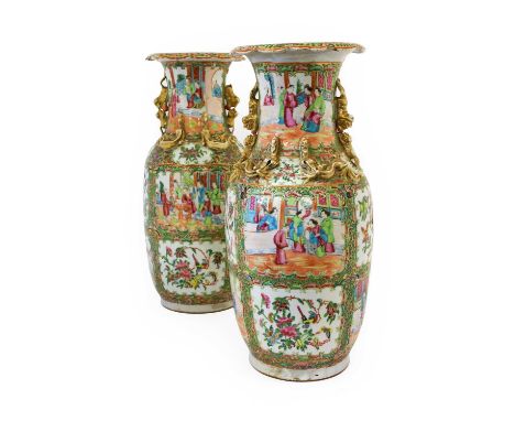 A Pair of Cantonese Porcelain Vases, mid 19th century, of baluster form, the trumpet necks applied with mythical beasts, typi