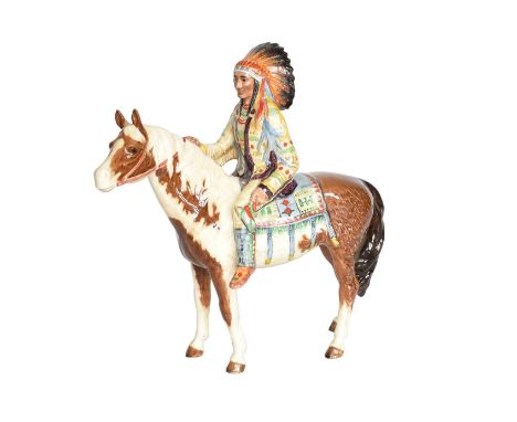 Beswick Mounted Indian, model No. 1391, skewbald glossHeavy crazing throughout but overall good condition.