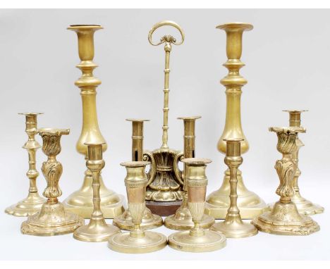 A Victorian Brass Mounted Door Stop, together with assorated 18th and 19th century brass candlesticks (one tray)