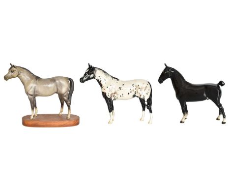 Beswick Horses Comprising: Appaloosa Stallion, model No. 1772, black and white gloss; Hackney, model No. 1361, black gloss; a