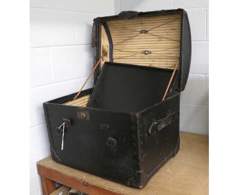 A Black Leather Mounted Domed Trunk with a striped fabric lining, enclosing wooden and other shoe trees, pair of art deco woo
