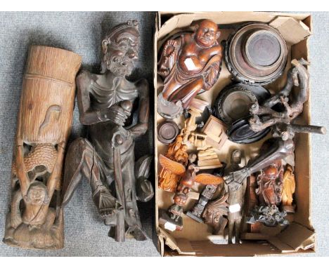 A Chinese Carved Hardwood Statue Formed as a Nomad, together with other similar hardwood, boxwood and bamboo carvings, includ