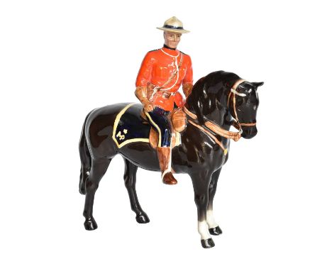 Beswick Canadian Mountie, model No. 1375, black glossMinor nibble to the tip of one ear of horse and to the rim of the hat, w