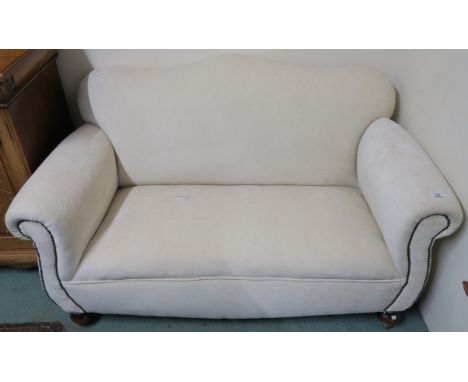 A cream upholstered two seater sofa, 85cm high x 150cm wide x 85cm deep Condition Report: Available upon request